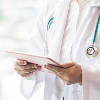 Physician holding tablet away from body to read